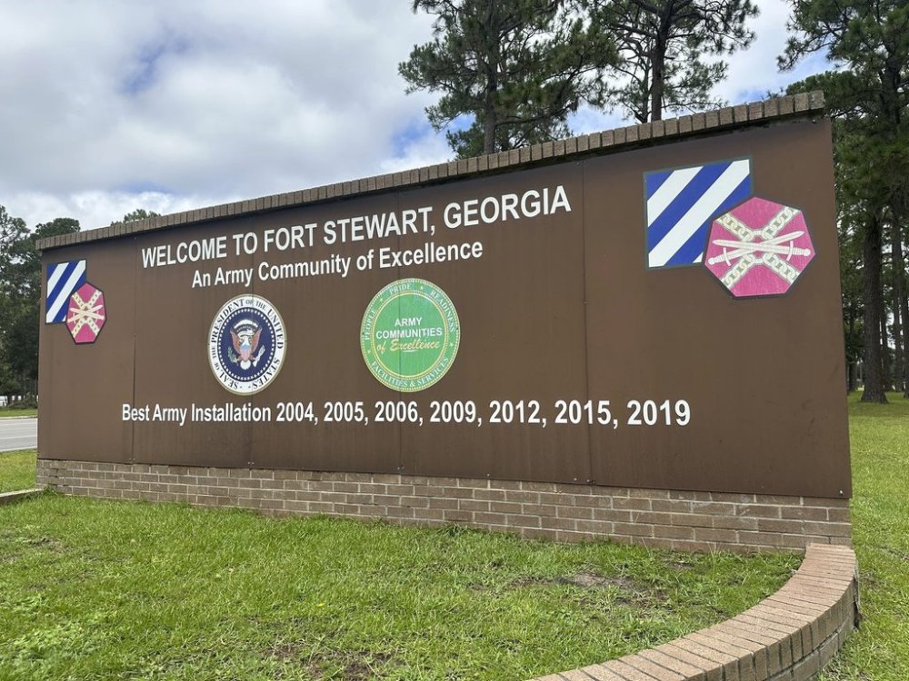 A sign outside the main gate of Fort Stewart, Georgia, is shown on Wednesday, Aug. 6, 2025. (AP Photo/Russ Bynum)
