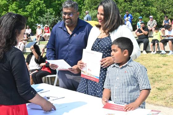 Ruchira Senevirathne, his wife Savani Senevirathne and son Saveith celebrate after signing their citizenship papers. (Matthew Frank / Free Press)