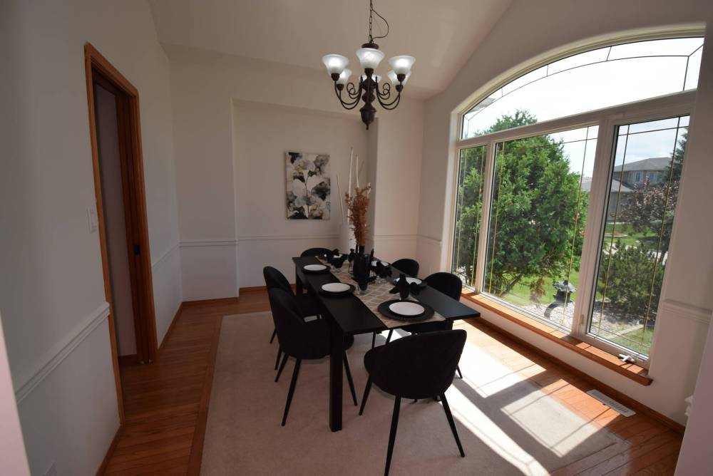 TODD LEWYS / FREE PRESS
A huge picture window and vaulted ceiling make the formal dining room at 33 Breland Bay a pleasure to entertain in.