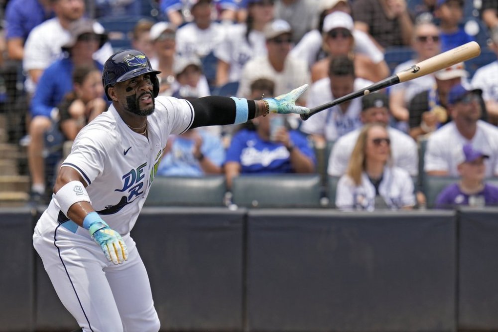 Tampa Bay Rays' Yandy Díaz drops his bat as he watches his solo home run off Los Angeles Dodgers pitcher Blake Snell during the first inning of a baseball game Saturday, Aug. 2, 2025, in Tampa, Fla. (AP Photo/Chris O'Meara)
