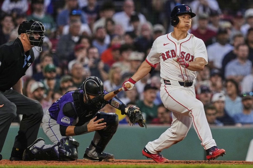 Boston Red Sox designated hitter Masataka Yoshida watches his RBI single during the fourth inning of a baseball game against the Colorado Rockies at Fenway Park, Wednesday, July 9, 2025, in Boston. (AP Photo/Charles Krupa)