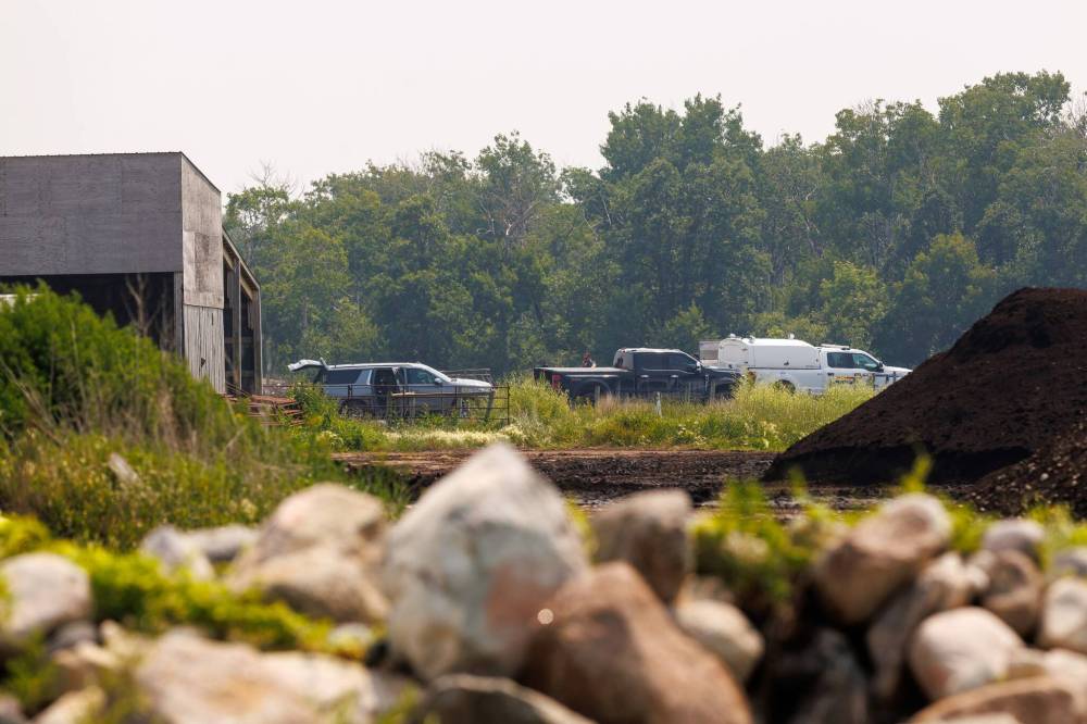 MIKE DEAL / FREE PRESS
Investigators at the scene of where two planes from Harv’s Air flight school crashed south of Steinbach Tuesday.