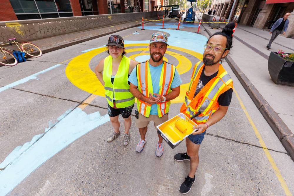 MIKE DEAL / FREE PRESS
From left: artist Alex Plante, project manager Stéphane Dorge and artistic lead Takashi Iwasaki are painting murals along a four-block stretch of Graham Avenue, which is transitioning from a bus corridor to a pedestrian space.