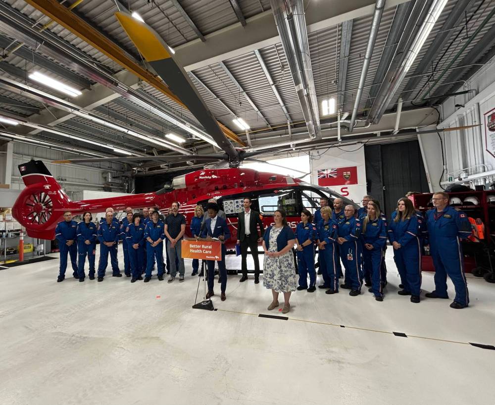 Tyler Searle / Winnipeg Free Press
Health Minister Uzoma Asagwara was flanked by STARS Air Ambulance members Thursday, during a news conference announcing a renewed 10-year contract between the province and the private service.