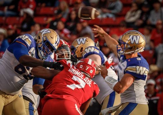 Winnipeg Blue Bombers quarterback Zach Collaros (right) knows turnovers were a large part of the Calgary Stampeders’ success against the Blue and Gold in Week 4. (Jeff McIntosh / The Canadian Press files)