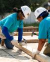 SUPPLIED 
                                Holly Jefferson (left) and members of the Bombers Women’s Club work on a Habitat for Humanity house in Transcona last week.