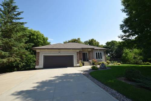 Magnificent from start to finish, this bungalow sits in a private, stunning setting just minutes from the city.