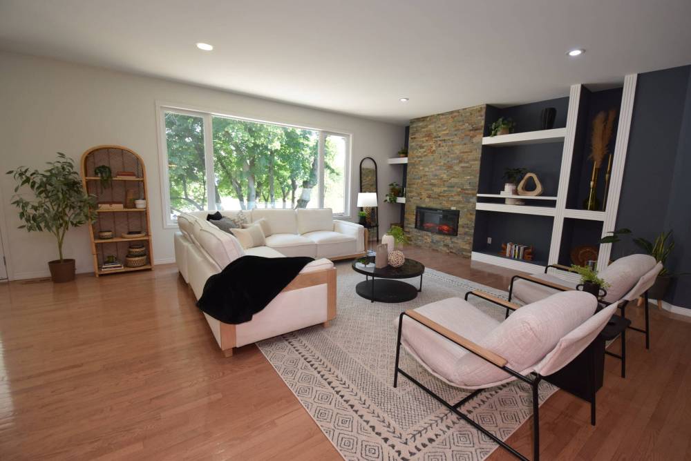 The quietly spectacular great room offers a lovely river view and has a warm, inviting ambience.