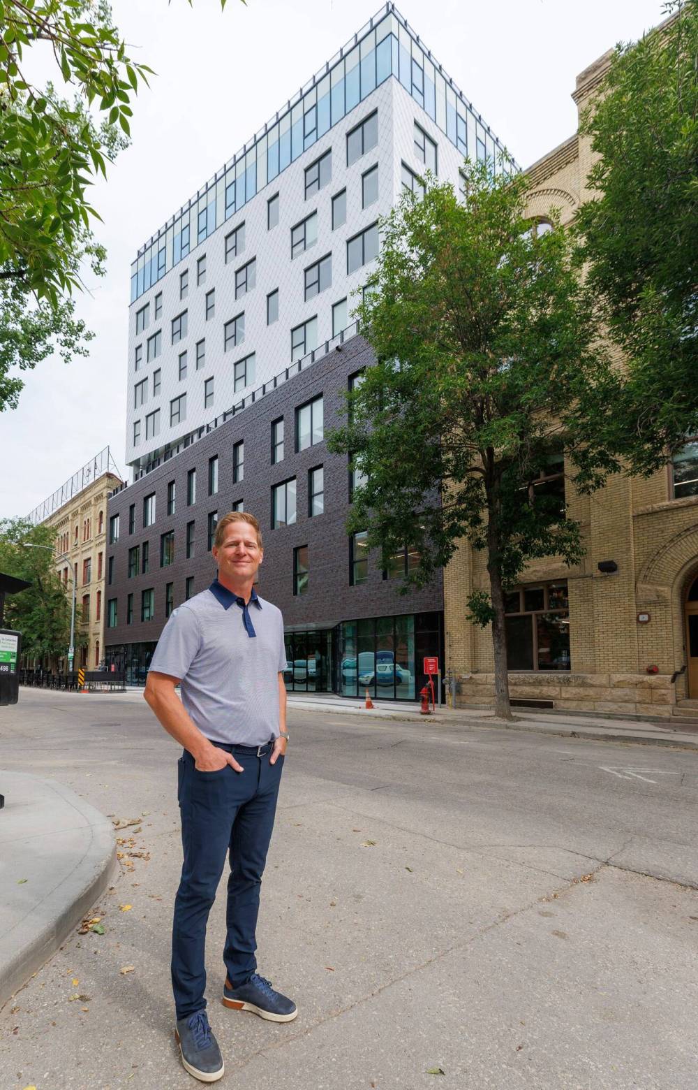 MIKE DEAL / FREE PRESS
                                Nolan Ploegman, president and CEO of Concord Projects, outside the new apartment block at 127 Bannatyne Avenue.