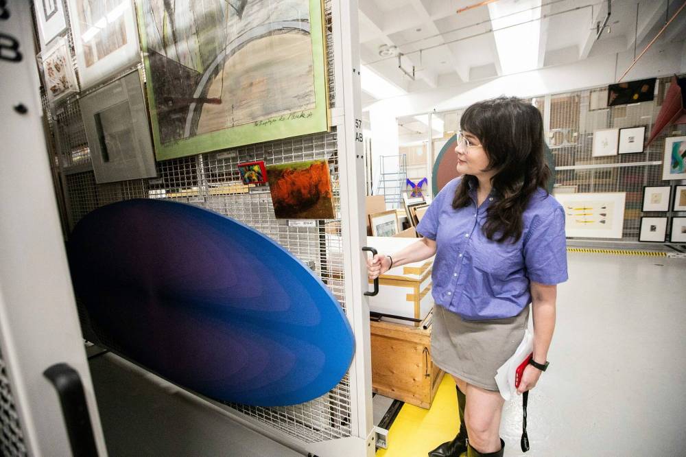 MIKAELA MACKENZIE / FREE PRESS
Curator Grace Braniff gives a tour of a vault at the Winnipeg Art Gallery.