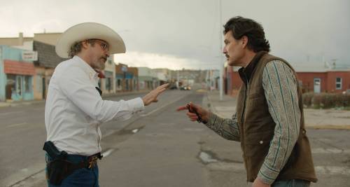 A24 photo
                                Joaquin Phoenix (left) as county sheriff Joe Cross and Pedro Pascal as mayor Ted Garcia in Eddington