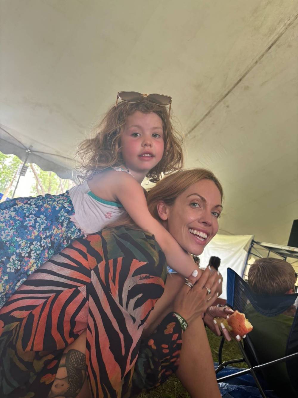 Freya Martin with her daughter at a past folk festival. (Supplied)