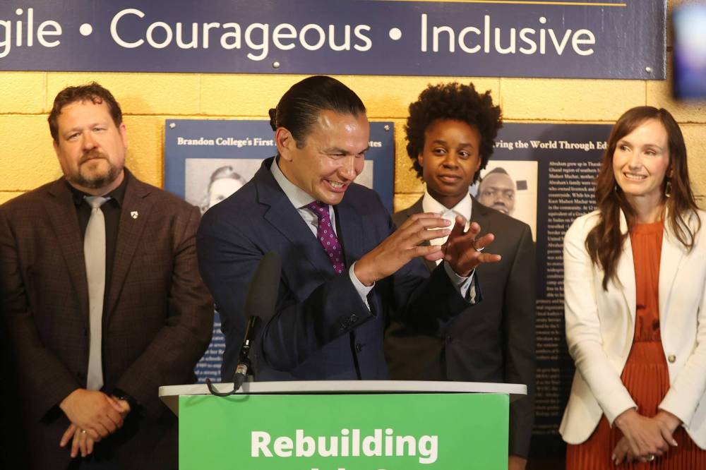 Tim Smith / The Brandon Sun
Premier Wab Kinew reacts while sparring with a reporter over the vacant Spruce Woods riding seat after an announcement at Brandon University’s Brodie Science Centre.