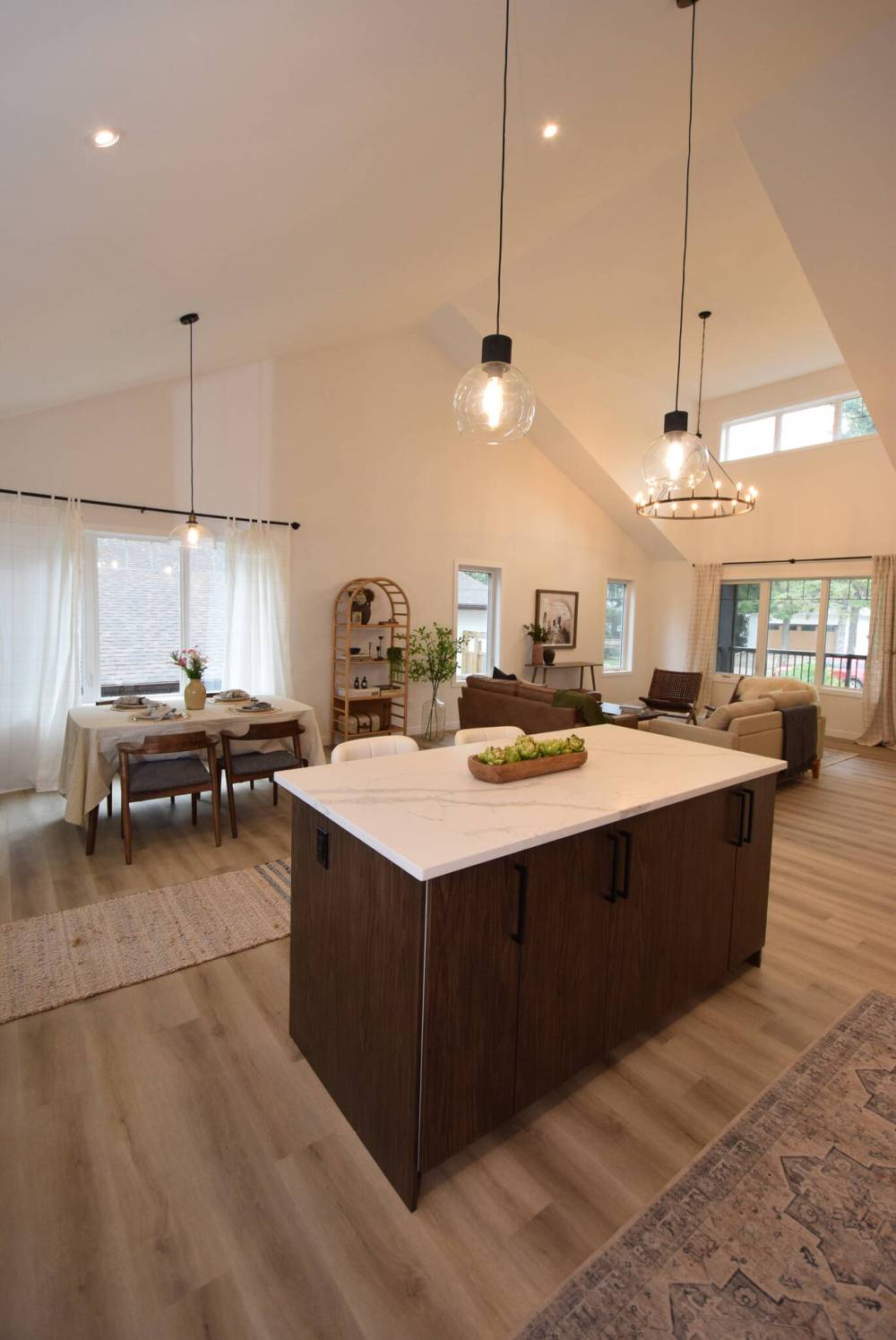 The kitchen offers a grand view of the main living area.