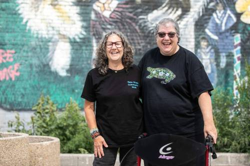MIKAELA MACKENZIE / FREE PRESS
                                Carina Blumgrund (right) with frequent Main Street Community Walk partner Cindy Singer.