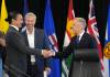 Nathan Denette / THE CANADIAN PRESS
                                Canadian Prime Minister Mark Carney, right, greets Manitoba Premier Wab Kinew, left, as Nova Scotia Premier Tim Houston looks on, during the 2025 summer meetings of Canada’s Premiers at Deerhurst Resort in Huntsville, Ont., on Tuesday.