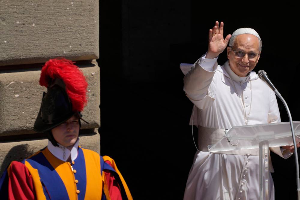 Gregorio Borgia / The Associatecd Press files
Pope Leo XIV waves to faithful in the square in front of the Apostolic Palace for the noon Angelus prayer in Castel Gandolfo, Italy, last Sunday.