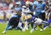 Toronto Argonauts running back Khalan Laborn (30) breaks a tackle from Winnipeg Blue Bombers defensive back Marquise Bridges (9) during first half CFL football action in Toronto on Saturday, July 26, 2025. THE CANADIAN PRESS/Nathan Denette