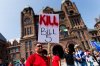 Protesters and community members chant and wave signs, as they listen to speakers during a demonstration opposing Bill 5, outside the Ontario Legislature at Queen's Park in Toronto, Monday, June 2, 2025. THE CANADIAN PRESS/Cole Burston