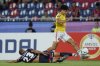 Kenji Cabrera of Peru's Melgar, top, and Victor Velazquez of Paraguay's Cerro Porteno battle for the ball during a Copa Libertadores soccer match at Nueva Olla stadium in Asuncion, Paraguay, Wednesday, March 12, 2025. (AP Photo/Jorge Saenz)