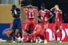 Bayern Munich's Jamal Musiala lies on the ground during the Club World Cup quarterfinal soccer match between PSG and Bayern Munich in Atlanta, Saturday, July 5, 2025. (AP Photo/Mike Stewart)
