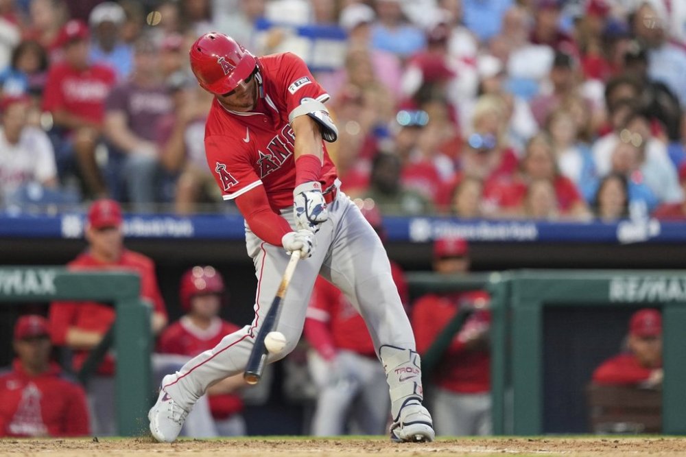 Los Angeles Angels' Mike Trout hits a run-scoring single against Philadelphia Phillies pitcher Jesús Luzardo during the fifth inning of a baseball game Friday, July 18, 2025, in Philadelphia. (AP Photo/Matt Slocum)