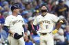 Milwaukee Brewers' Jackson Chourio (11) reacts after suffering an injury during the fifth inning of a baseball game against the Chicago Cubs, Tuesday, July 29, 2025, in Milwaukee. (AP Photo/Aaron Gash)