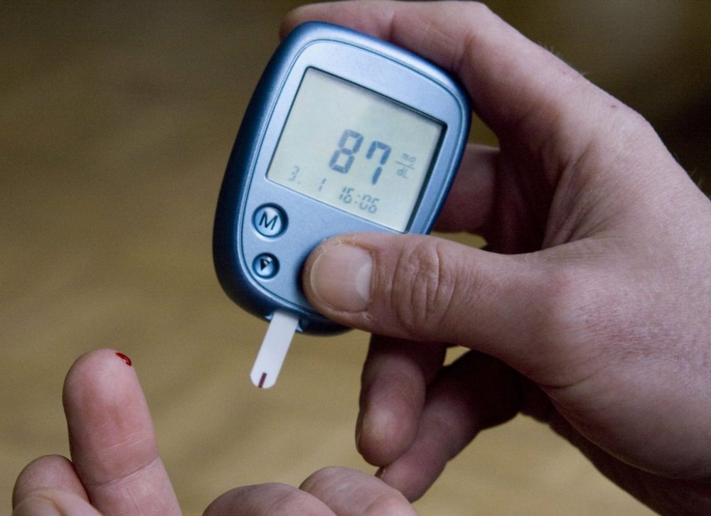 This Jan. 3, 2009 file photo shows a person with diabetes testing his blood sugar level in Kamen, Germany. (AP Photo/Joerg Sarbach, File)