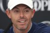 Rory McIlroy of Northern Ireland listens to a question from the media at a press conference ahead of the 2025 British Open golf championship at the Royal Portrush Golf Club, Northern Ireland, Monday, July 14, 2025. (AP Photo/Peter Morrison)