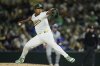 FILE - Athletics pitcher José Leclerc throws to a Chicago Cubs batter during the sixth inning of a baseball game, March 31, 2025, in West Sacramento, Calif. (AP Photo/Godofredo A. Vásquez, File)