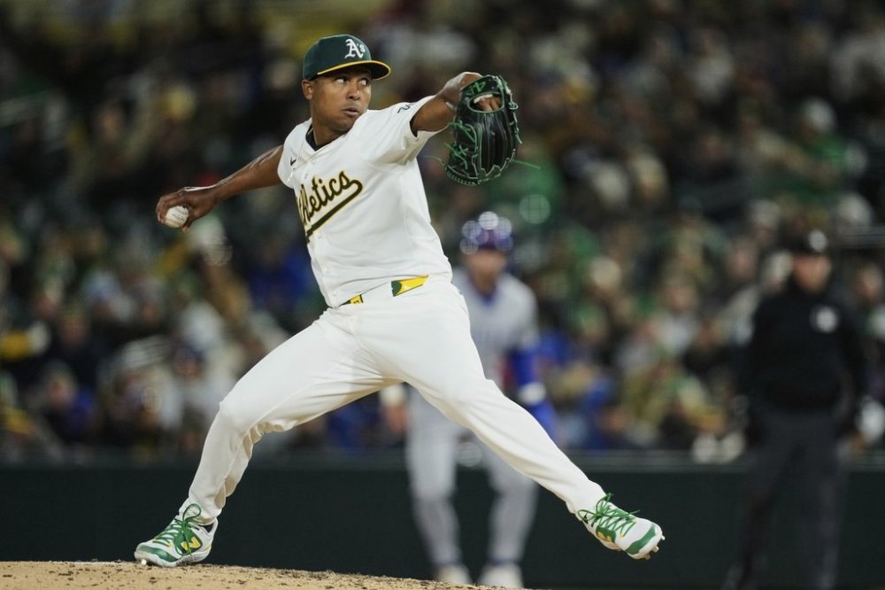 FILE - Athletics pitcher José Leclerc throws to a Chicago Cubs batter during the sixth inning of a baseball game, March 31, 2025, in West Sacramento, Calif. (AP Photo/Godofredo A. Vásquez, File)
