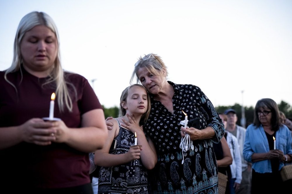People gather at a vigil for a nine-year-old Montreal girl whose body was found in their community over the weekend, in Ticonderoga, New York on Tuesday, July 22, 2025. THE CANADIAN PRESS/Christopher Katsarov