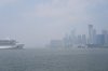 A cruise ship sits off the shore of Toronto amid air quality warnings on Monday July 14, 2025. THE CANADIAN PRESS/Chris Young