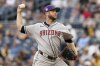 Arizona Diamondbacks pitcher Merrill Kelly delivers during the first inning of a baseball game against the Pittsburgh Pirates, Saturday, July 26, 2025, in Pittsburgh. (AP Photo/Matt Freed)