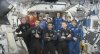 This photo provided by Axiom Space shows the private crew of four, in dark suits, from left, Axiom mission commander Peggy Whitson, Hungary's Tibor Kapu, India's Shubhanshu Shukla and Poland's Slawosz Uznanski-Wisniewski, during a farewell ceremony aboard the International Space Station on Sunday, July 13, 2025. (Axiom Space via AP)