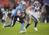 Toronto Argonauts quarterback Nick Arbuckle (4) runs the ball past Winnipeg Blue Bombers defensive lineman Jake Thomas (95) during first half CFL football action in Toronto on Saturday, July 26, 2025. THE CANADIAN PRESS/Nathan Denette