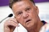 FILE - Head coach Louis van Gaal of the Netherlands adjusts his audio device during Netherlands official press conference on the eve of World Cup soccer match between Netherlands and Argentina in Doha, Qatar, Dec. 8, 2022. (AP Photo/Eugene Hoshiko, File)