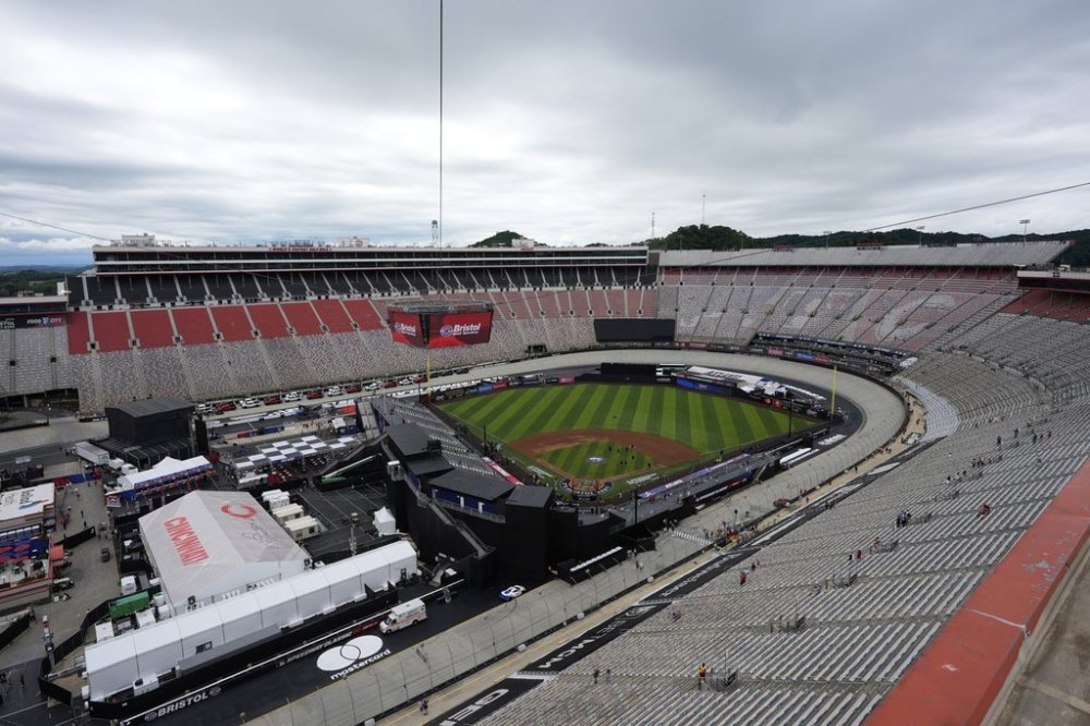 Members of the grounds crew prepare the field prior to the MLB Speedway Classic baseball game at Bristol Motor Speedway in Bristol, Tenn., Saturday, Aug. 2, 2025. (AP Photo/George Walker IV)