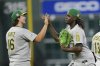 Athletics' Nick Kurtz (16) and Lawrence Butler celebrate after a baseball game against the Houston Astros Saturday, July 26, 2025, in Houston. (AP Photo/David J. Phillip)