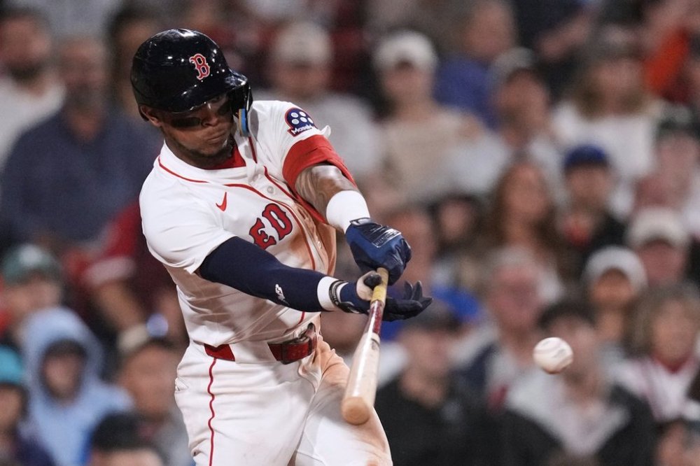 Boston Red Sox's Ceddanne Rafaela connects for a two RBI single against the Tampa Bay Rays during the seventh inning of a baseball game at Fenway Park, Thursday, July 10, 2025, in Boston. (AP Photo/Charles Krupa)