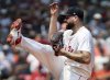 Boston Red Sox starting pitcher Lucas Giolito follows through on a pitch during a baseball game against the Houston Astros, Sunday, Aug. 3, 2025, in Boston (AP Photo/Jim Davis)