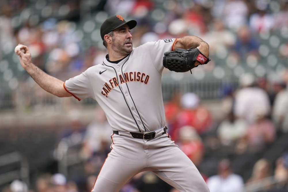 San Francisco Giants pitcher Justin Verlander (35) delivers in the first inning of a baseball game against the Atlanta Braves, Wednesday, July 23, 2025, in Atlanta. (AP Photo/Mike Stewart)