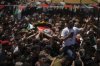 Mourners carry the bodies of Palestinian-American Sayfollah Musallet, 20, and Mohammed al-Shalabi during their funeral in the West Bank village of Al-Mazraa a-Sharqiya on Sunday, July 13, 2025. According to the Palestinian Health Ministry, Musallet was killed in an attack by Israeli settlers and al-Shalabi was shot in the chest. (AP Photo/Leo Correa)