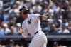 New York Yankees' Aaron Judge (99) hits a double during the seventh inning of a baseball game against the Chicago Cubs, Saturday, July 12, 2025, in New York. (AP Photo/Yuki Iwamura)