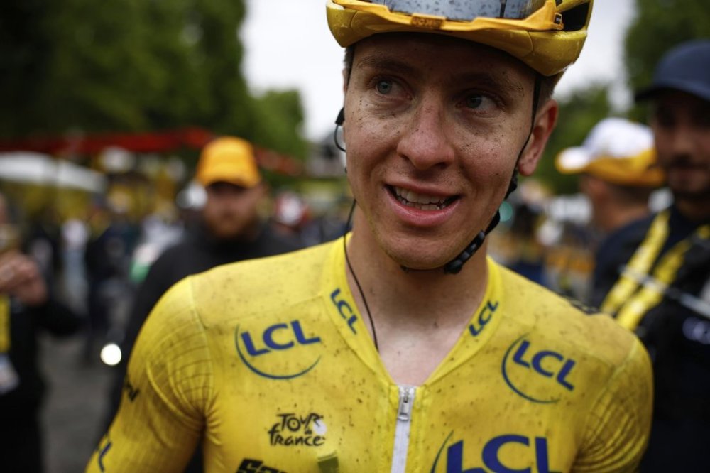 Slovenia's Tadej Pogacar, the Tour de France winner, smiles after finishing, the twenty-first stage of the Tour de France cycling race over 132.3 kilometers (82.1 miles) with start in Mantes-la-Ville and finish on the Champs-Elysees in Paris, France, Sunday, July 27, 2025. (Yoan Valat, Pool Photo via AP)
