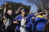 Rosario Central soccer fans get revved up as they arrive for a soccer match in Buenos Aires, Saturday, July 19, 2025, after the soccer federation lifted a 12-year ban as a test run on away fans in Argentina’s local leagues. (AP Photo/Gustavo Garello)