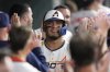 Houston Astros' Isaac Paredes celebrates in the dugout after hitting a home run against the Cleveland Guardians during the fifth inning of a baseball game Monday, July 7, 2025, in Houston. (AP Photo/David J. Phillip)