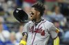 Atlanta Braves' Ronald Acuna Jr. celebrates after scoring on a three-run double hit by Austin Riley during the eighth inning of a baseball game against the Kansas City Royals, Monday, July 28, 2025, in Kansas City, Mo. (AP Photo/Charlie Riedel)