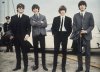 FILE - The Beatles, from left, John Lennon, George Harrison, Ringo Starr and Paul McCartney arrive in Liverpool, England on July 10, 1964, for the premiere of their movie 