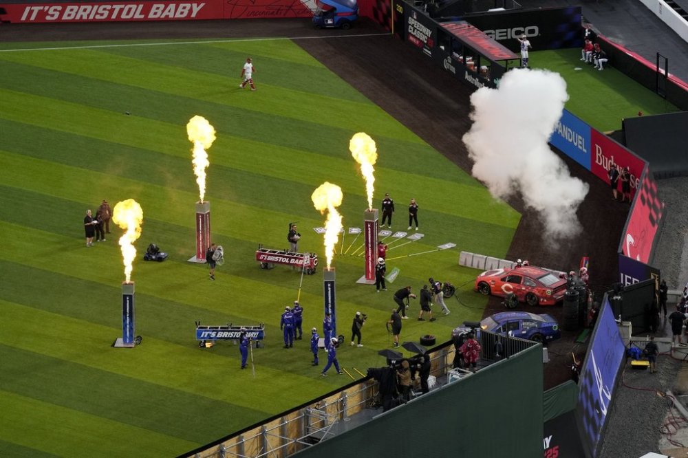 Players are introduced before the MLB Speedway Classic baseball game between the Atlanta Braves and the Cincinnati Reds at Bristol Motor Speedway in Bristol, Tenn., Saturday, Aug. 2, 2025. (AP Photo/George Walker IV)